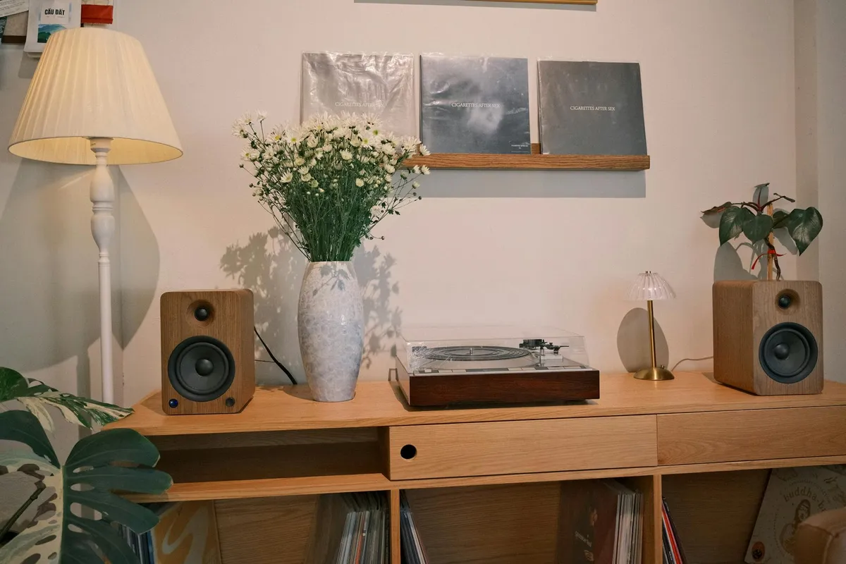 A record player and headphones in a cozy listening setup